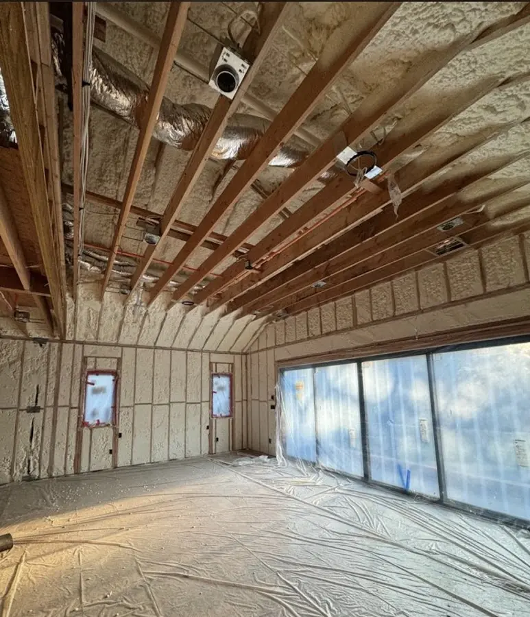 Interior walls and ceiling insulated with spray foam during new construction in Columbia Heights